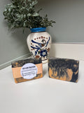 Handcrafted goat milk soap with orange and black colors