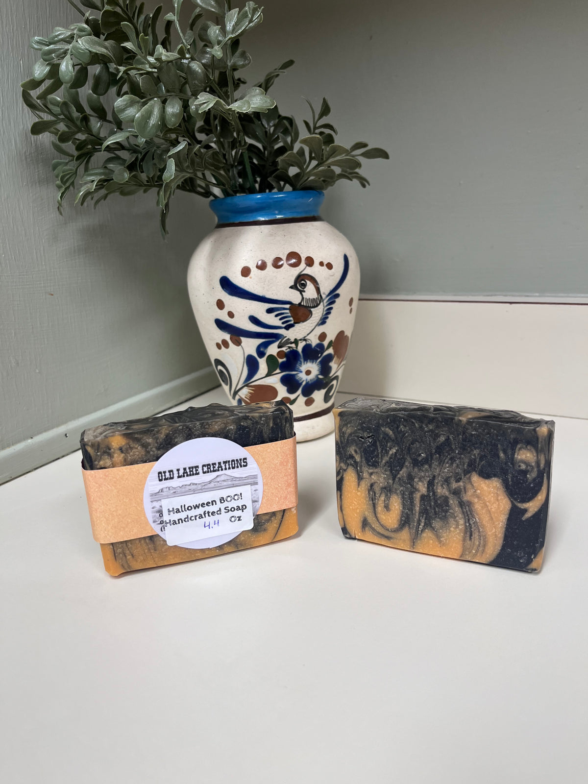 Handcrafted goat milk soap with orange and black colors
